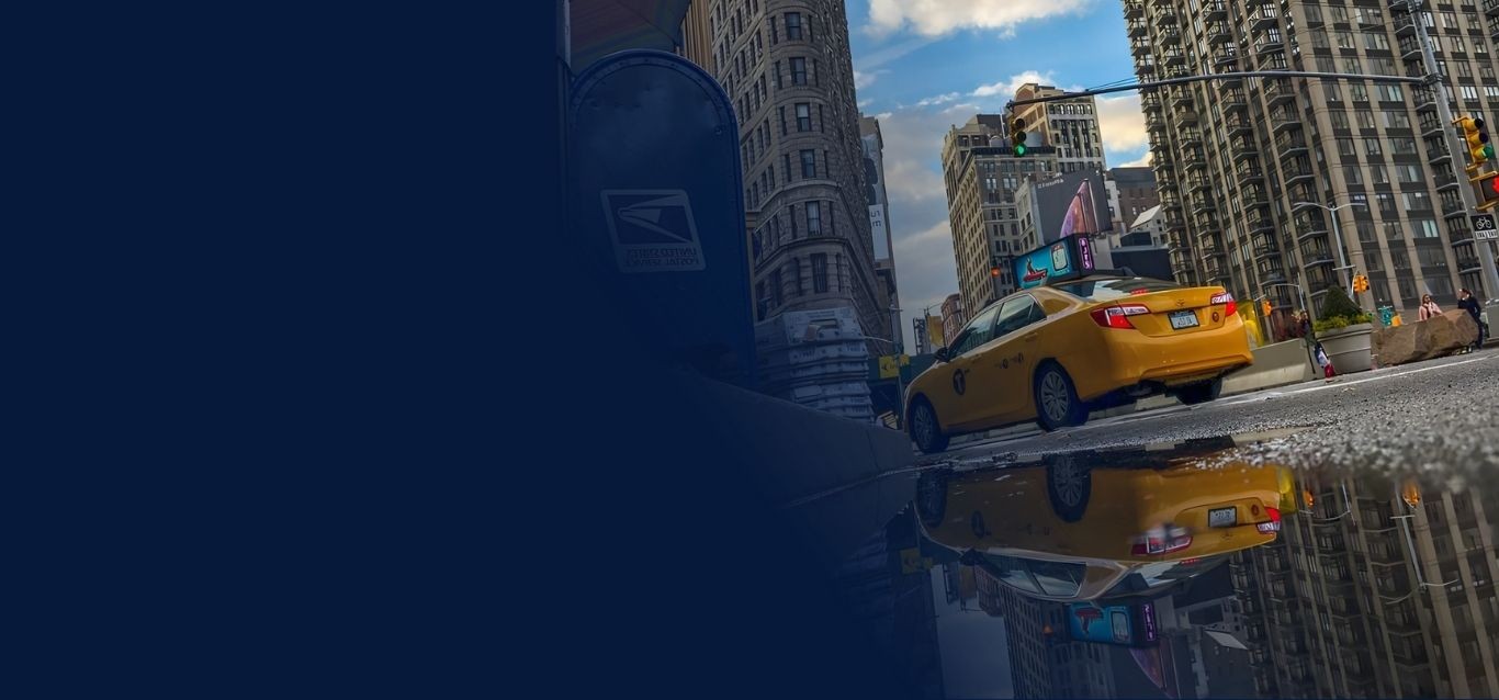 City street with a yellow taxi cab