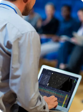 NEMT Owner Reviewing Dispatch Data at Industry Event