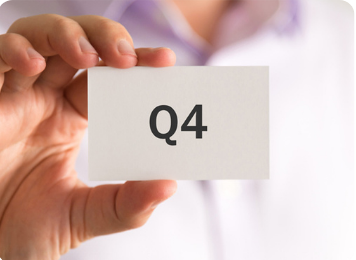 Hand Holding Q4 Card Representing Year-End Planning